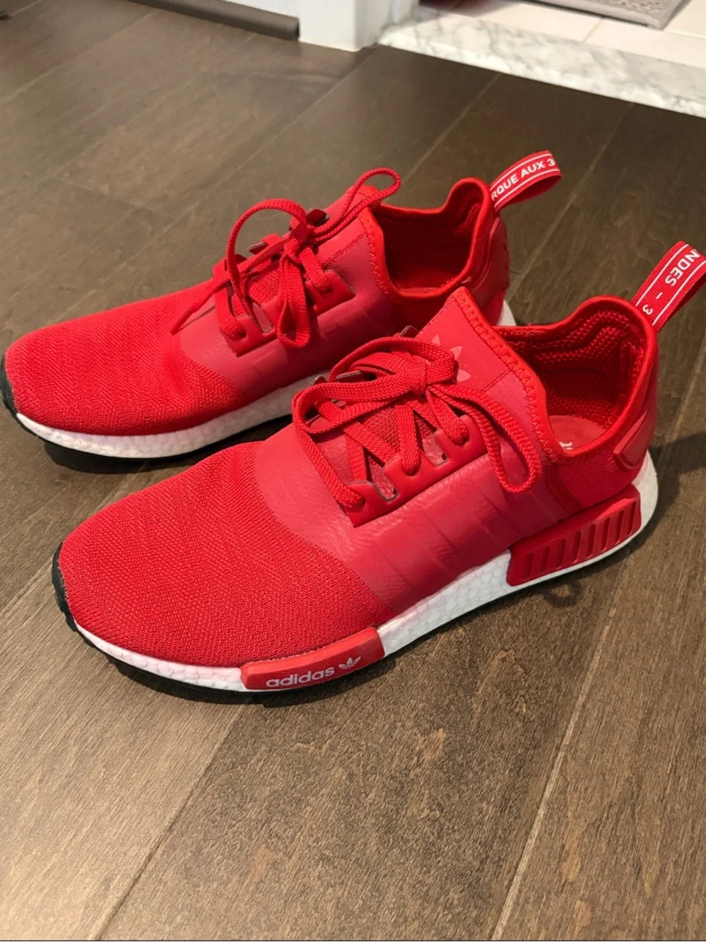 adidas NMD_R1 Primeknit Sneakers in Red